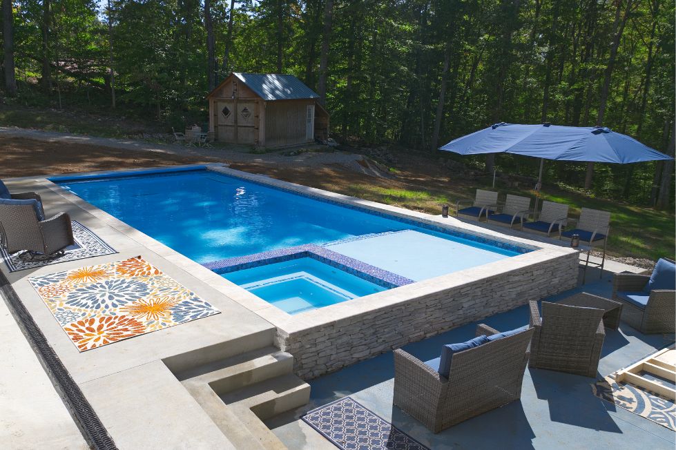 Custom pool with raised spa and sun shelf