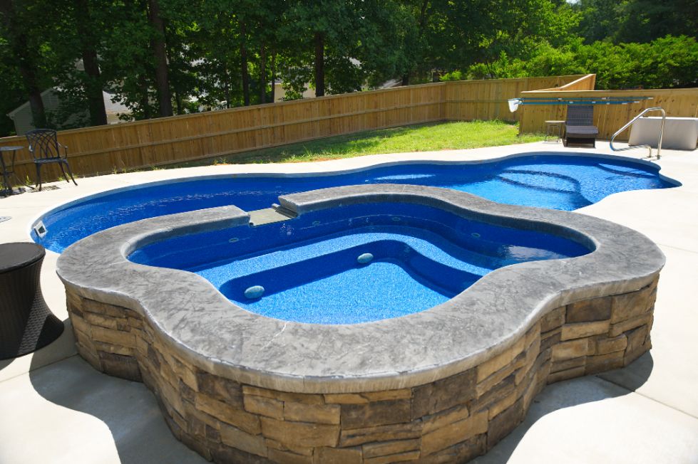 Fiberglass pool with raised spa