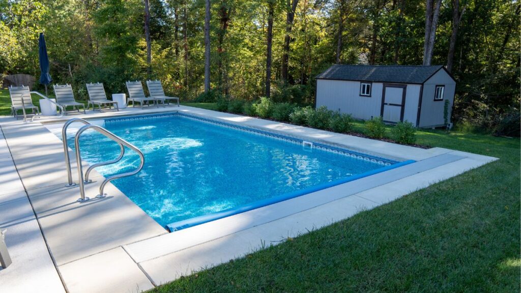 Vinyl liner pool with a concrete pool deck