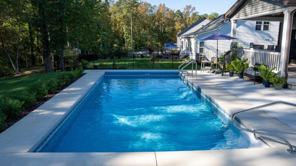Vinyl liner pool beside a backyard patio