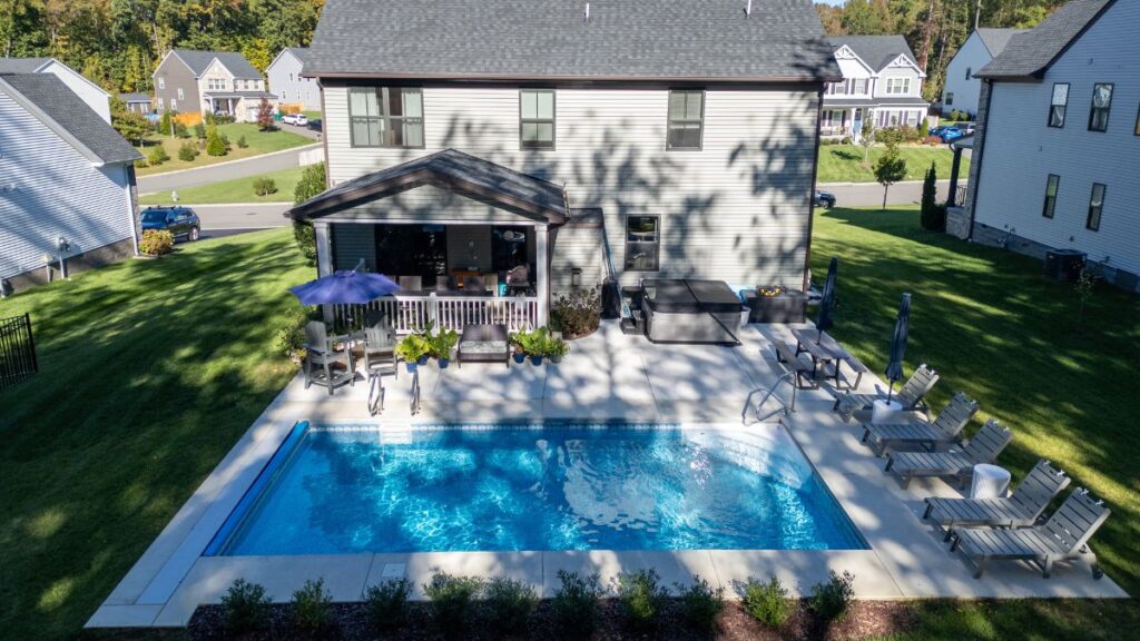 Vinyl liner pool with a spacious concrete pool deck